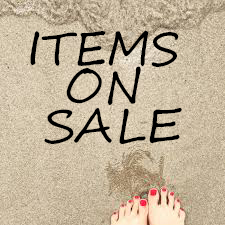 beach side picture of feet near shore with wording indicating these are Sales Items