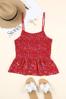 red smocked tank with small polka dots and flower accents in the fabric.